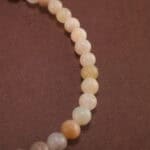 Close-up of multicolor amazonite bracelet with silver.