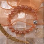 Peach moonstone bracelet in natural light with warm soft tones.