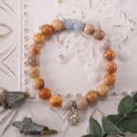 Bracelet in natural light showing picture jasper’s earthy hues and chalcedony’s blue glow.