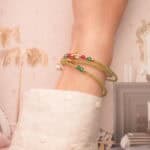 Prehnite bracelet wrapped three times around the wrist, offering a calming and elegant layered look.