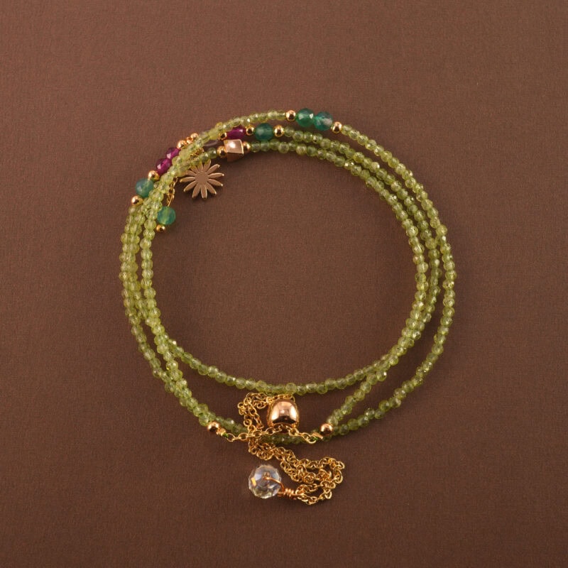 Multi-use necklace featuring soft green prehnite beads, arranged in a spiral layout to highlight its natural glow.