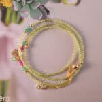 Full view of the prehnite necklace stretched out, showing consistent bead size and flexible multi-wear style.