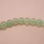Close-up of prehnite bracelet with silver accent.