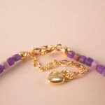 Close-up of purple chalcedony bracelet showing bead texture and clarity.