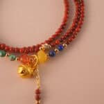 Close-up of red agate and lapis lazuli beads, showing polished surfaces and natural textures.