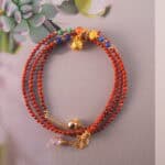 Full layout of the necklace displaying the alternating pattern of red agate and lapis lazuli, designed for versatile wear.