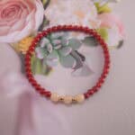 Bracelet in natural light showing warm red and soft white.