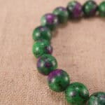 Close-up of ruby in zoisite bracelet with S925 silver accent beads.