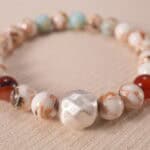 Close-up of Shoushan stone bracelet with sterling silver accents.