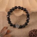 Silver obsidian bracelet in natural light showing metallic sheen.