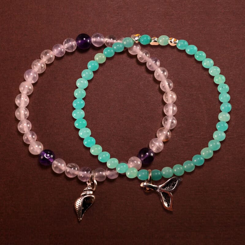 Main image of stacked amazonite, amethyst and chalcedony bracelets.