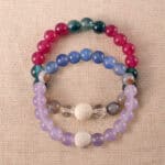 Main image of stacked bracelets with cool-toned gemstone mix.