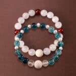 Main image of stacked bracelets with ocean and earth tones.