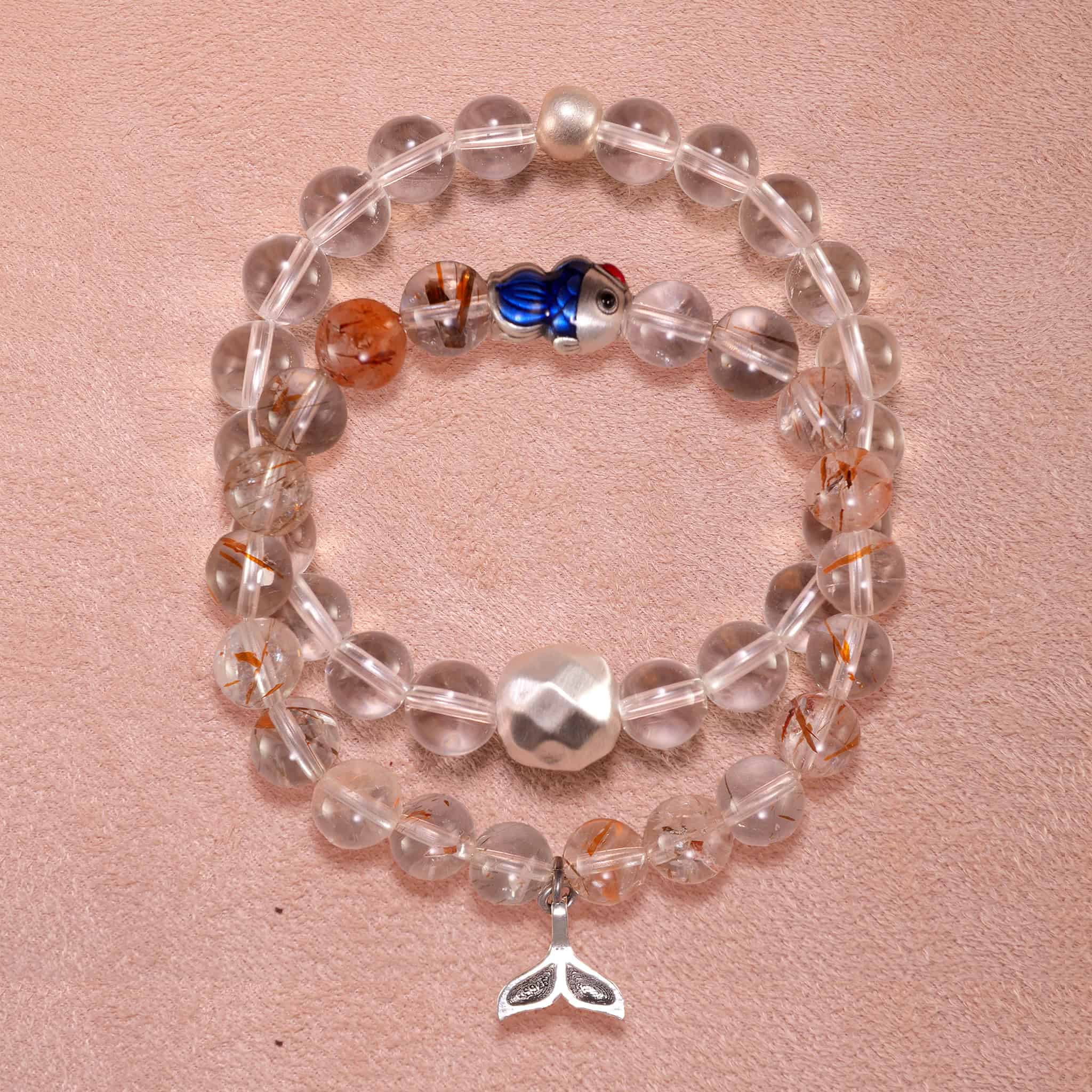 Main image of stacked bracelets: clear quartz and rutilated quartz with S925 silver.