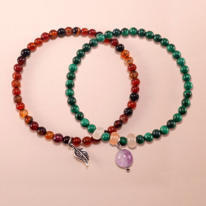 Main image of stacked flower red agate, malachite, and amethyst bracelets.
