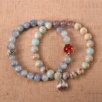 Main image of stacked bracelets in vibrant red, blue, and warm beige.