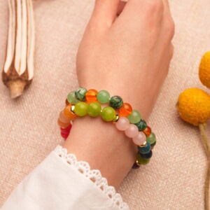 Model wearing colorful gemstone stack with natural energy.