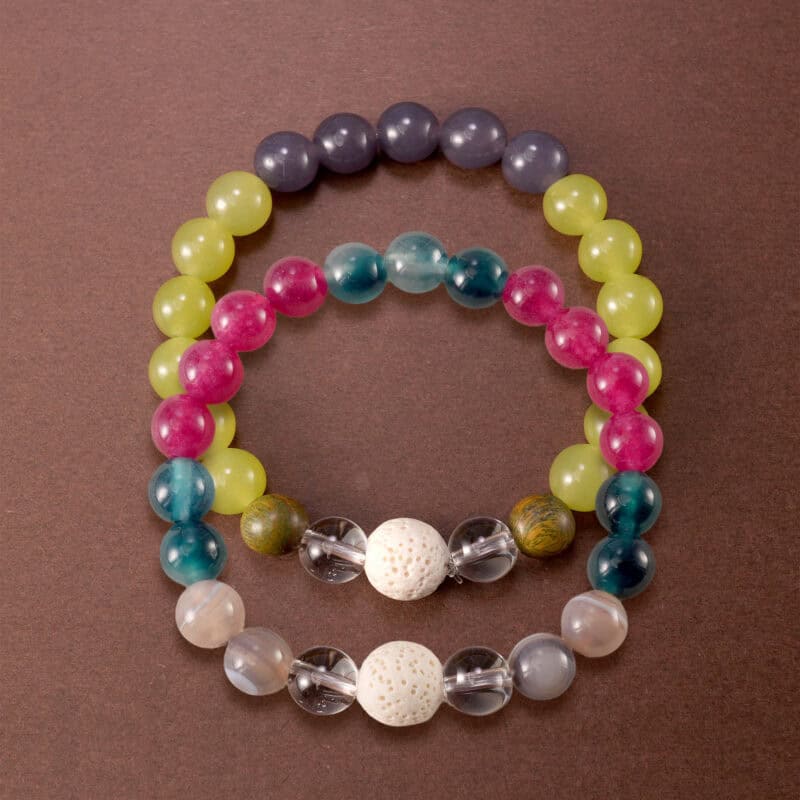 Main image of stacked gemstone bracelets in colorful and muted mix.