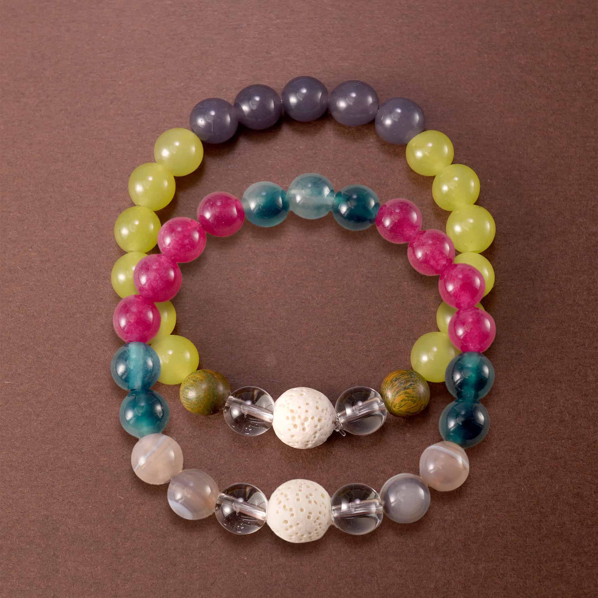 Main image of stacked gemstone bracelets in colorful and muted mix.
