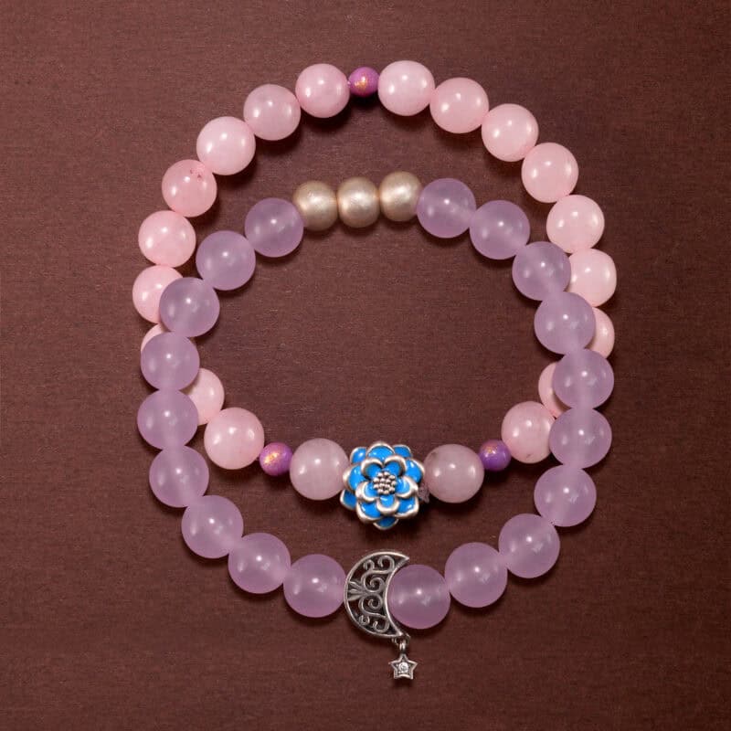 Main image of stacked rose quartz and amethyst bracelets together.