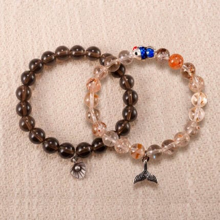 Main image of stacked bracelets: smoky quartz and rutilated quartz with S925 silver.