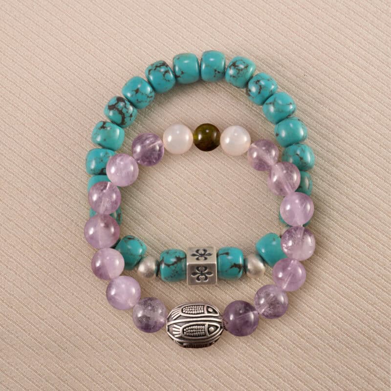 Main image of stacked bracelets: turquoise and lavender-white gemstone combo.