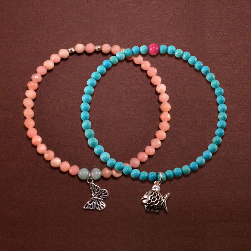 Main image of stacked turquoise, rhodochrosite and chalcedony bracelets.