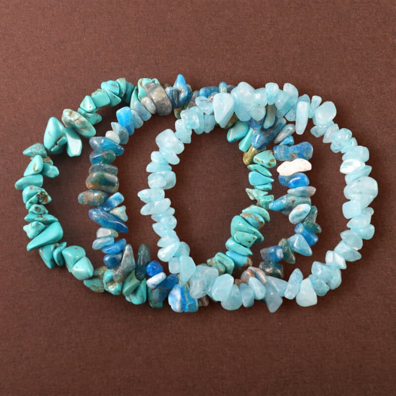 Main image of stacked irregular gemstone bracelets.