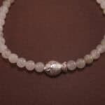 Close-up of white chalcedony bracelet with silver.
