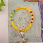 Bracelet in natural light showing warm yellow and red tones.