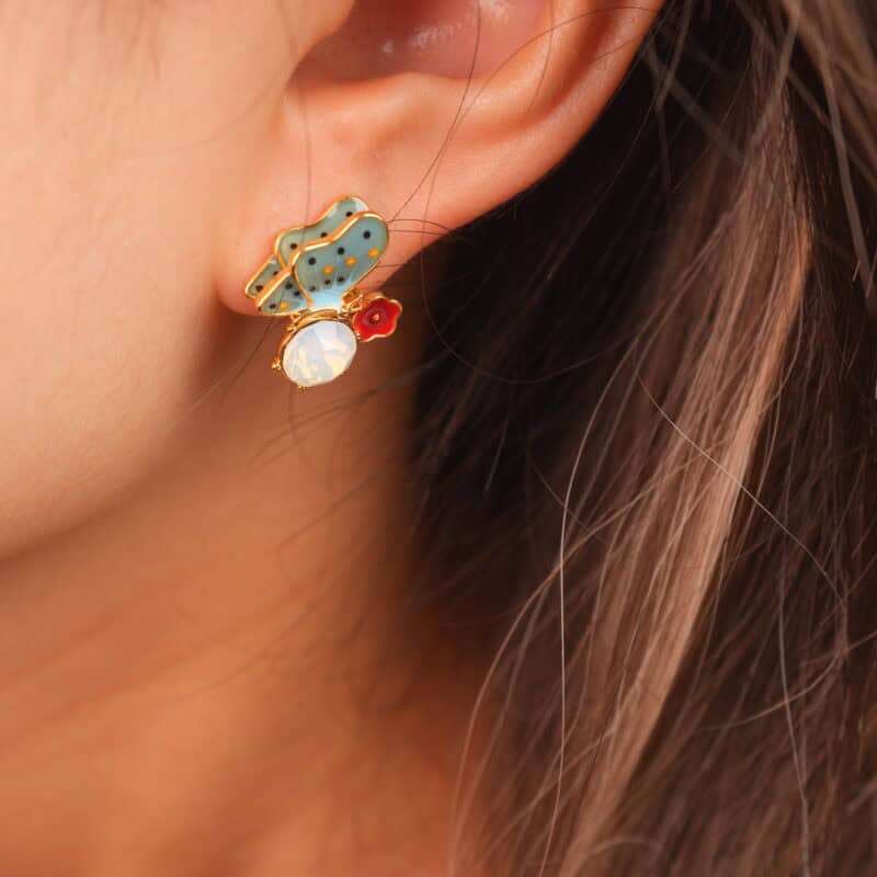 Model wearing butterfly opal studs, showing a fresh and sweet look.
