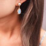 Model wearing the earrings, highlighting their elegant style and gentle luster.