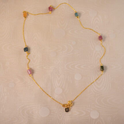 Tourmaline delicate necklace on white background