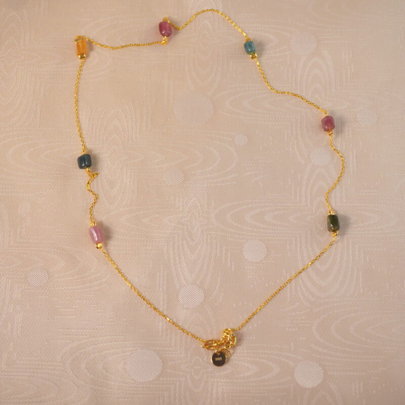 Tourmaline delicate necklace on white background