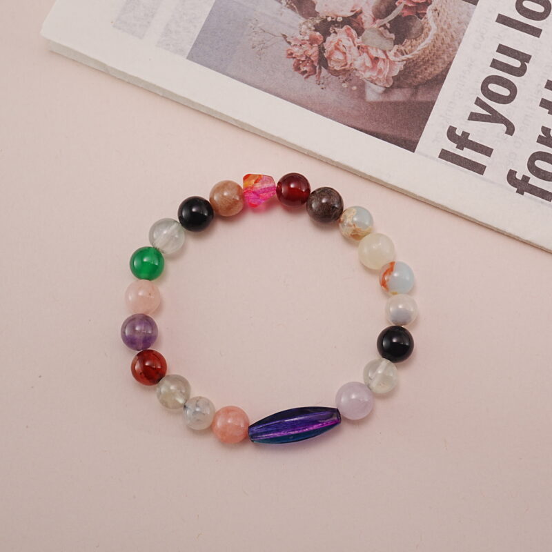 The multi-gemstone bracelet displayed on a soft background, emphasizing its vibrant hues and elegant design. A perfect addition to any style, bringing a sense of dynamic energy and harmony.