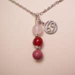 Cancer zodiac necklace with clear quartz, red agate, and rhodochrosite gemstones.