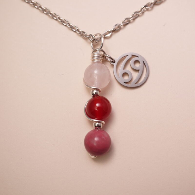 Cancer zodiac necklace with clear quartz, red agate, and rhodochrosite gemstones.