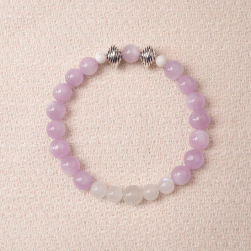 Kunzite and moonstone bracelet featuring soft lavender and milky white beads, symbolizing calm and emotional balance.