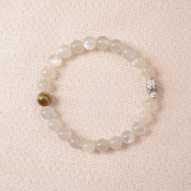 Moonstone bracelet with soft white shimmer, symbolizing calm energy and emotional balance.