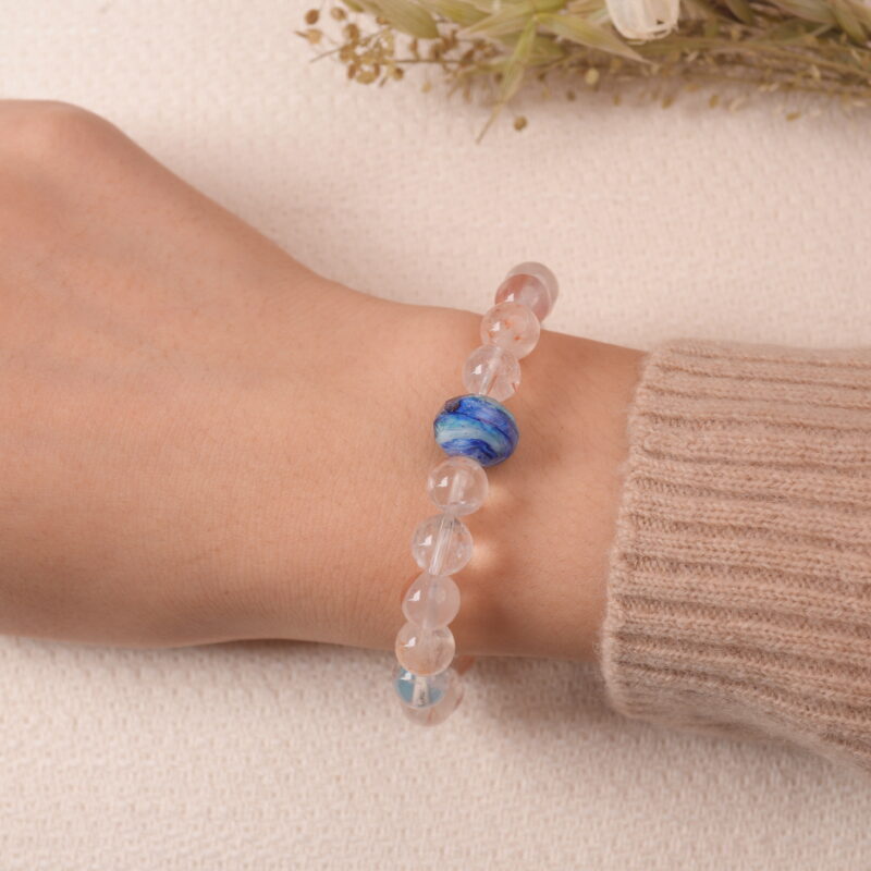 Model wearing Red Hematoid Quartz bracelet, showing elegant reddish tones and natural crystal clarity.