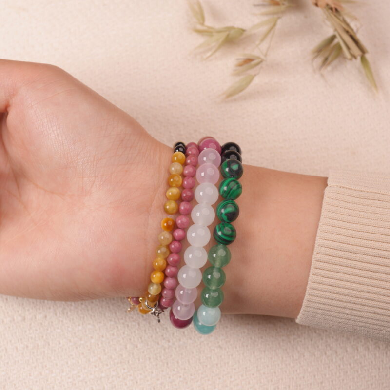 Model wearing the Blossom Heart bracelet stack — a radiant expression of love and tenderness.2