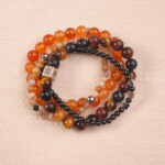 Multi-gemstone bracelet stack featuring carnelian, tiger eye and obsidian – vitality intention main image.