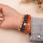 Vitality gemstone bracelet stack worn on wrist, front view.