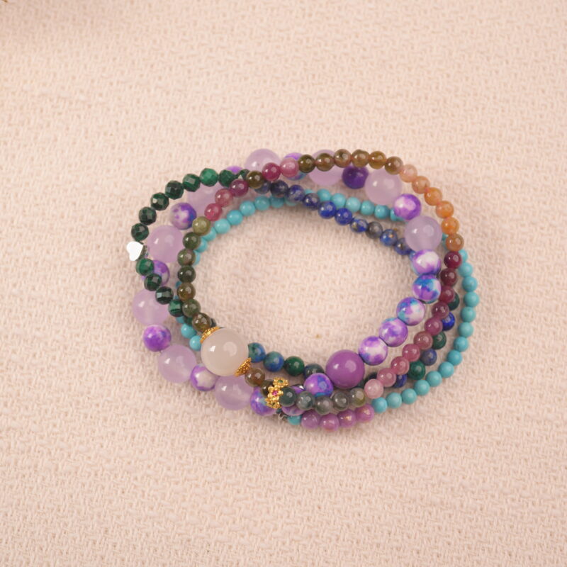 Calm intention crystal bracelet stack featuring green chalcedony, purple beads and blue-green stones