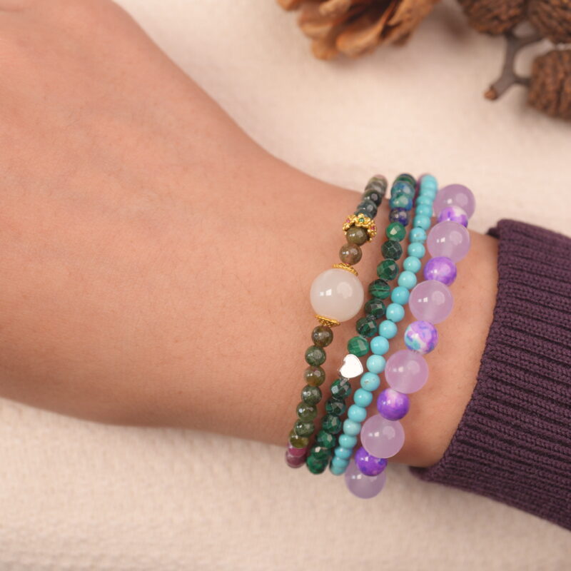 Calm intention multi gemstone bracelet stack on wrist with green, purple and blue chalcedony
