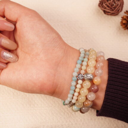Calm intention bracelet stack with moonstone, amazonite and jade beads worn on wrist