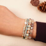 Wrist wearing calm intention bracelet set made with moonstone, amazonite and jade beads