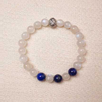 A calming Moonstone and Lapis Lazuli bracelet, featuring smooth, glowing Moonstone beads contrasted with the deep, rich blue of Lapis Lazuli. Finished with a stylish silver accent bead.