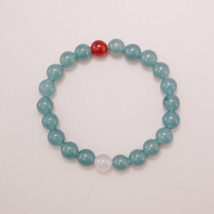 A beautiful Green Aventurine and Red Agate bracelet featuring soothing green tones with a pop of vibrant red. Perfect for calming energy and emotional balance.