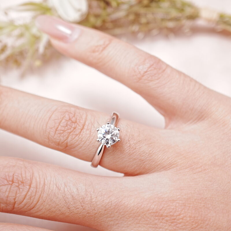 Woman wearing S925 moissanite solitaire ring on hand